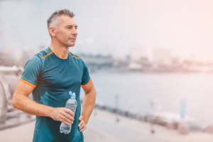 man contemplates taking gluathione supplement post-workout for exercise recovery