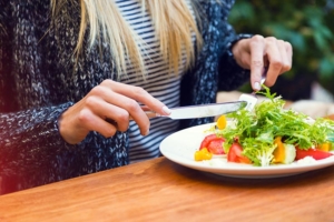 woman eating healthy meal to help with full body cleanse