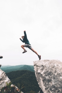 man uses up all his energy to jump