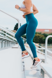 woman runs up stairs as part of a healthy lifestyle