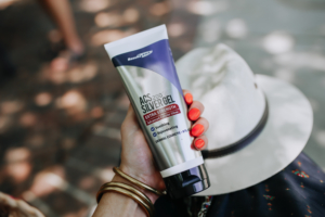 Woman holds ACS 200 Silver Gel in Sun