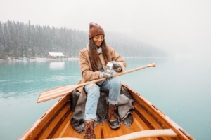 woman in boat to stay active in winter