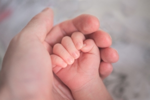 hands of different ages holding