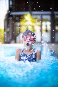 girl swimming to detox