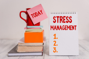 Word writing text Stress Management. Business photo showcasing method of limiting stress and its effects by learning ways Cup sticky note stacked note pads books square box spiral wooden table. Stress relief results rna